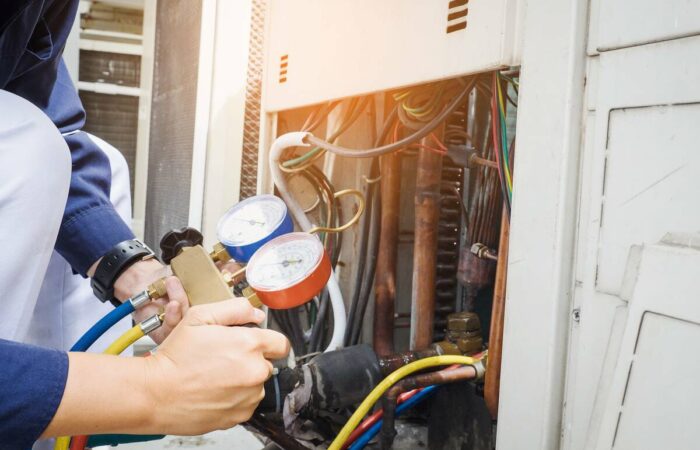 business-equipment-finance-1200 man checking electricity meter