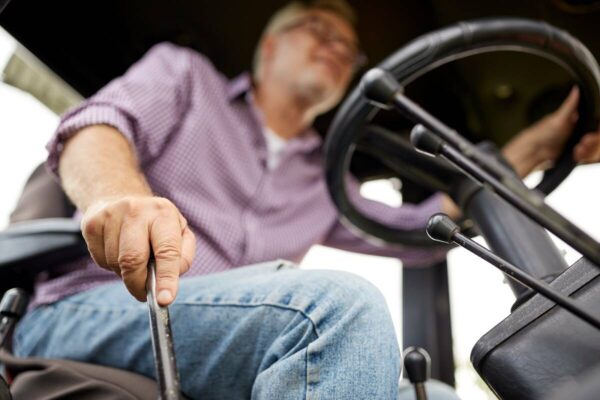 farmer-driving-tractor-he-bought-1200 farmer-driving-tractor-he-bought-1200