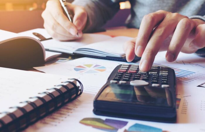 person-calculating-asset-finance-1200 person calculating asset finance