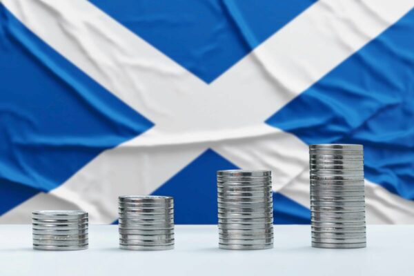 scottish flag with money in front