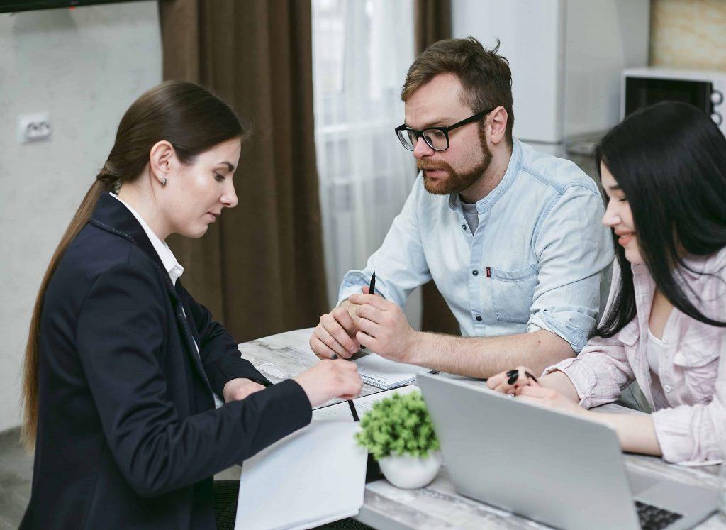 An individual signing a contract, symbolizing the commitment involved in securing a limited company loan.